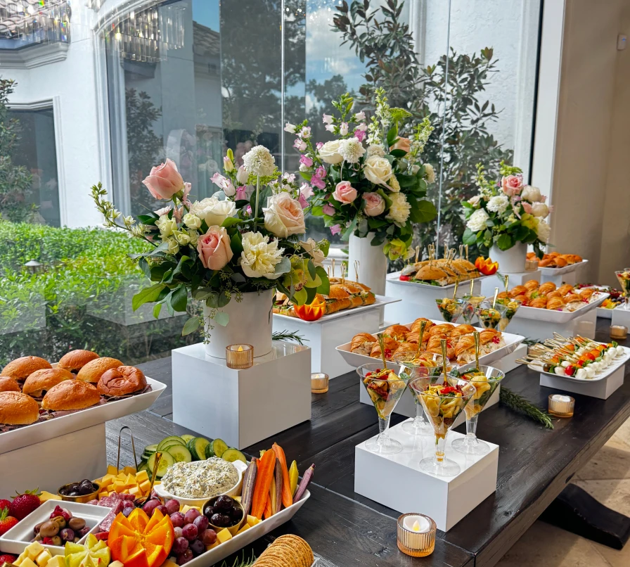 Colorful appetizers and floral arrangements